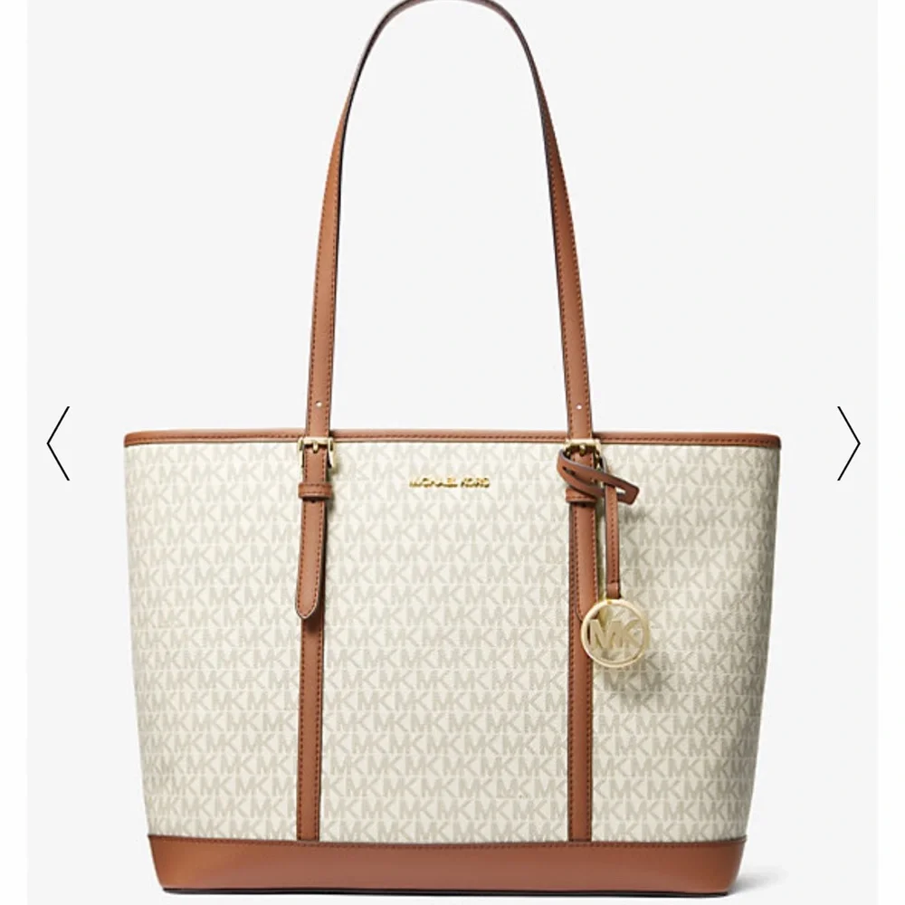 MICHAEL KORS
Jet Set Travel Large Logo Tote Shoulder Bag
COLOR VANILLA 
NWT - Picture 4 of 16